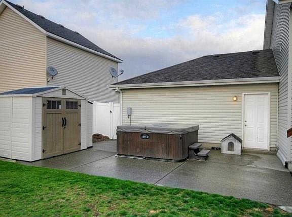 backyard- shed, hot tub, and dog house no longer on the patio.