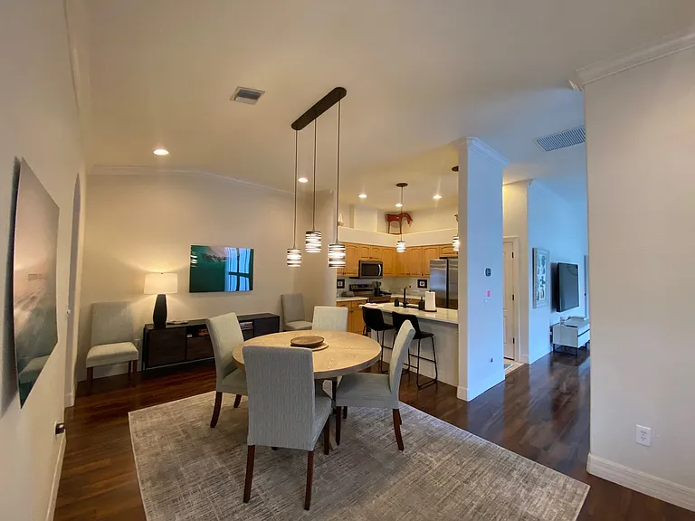 Wonderful open dining room with open kitchen with eat at counter!