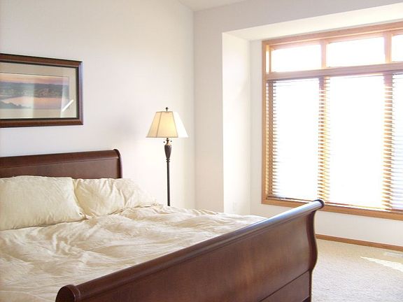 Master bedroom, with large widows looking out to the pond!