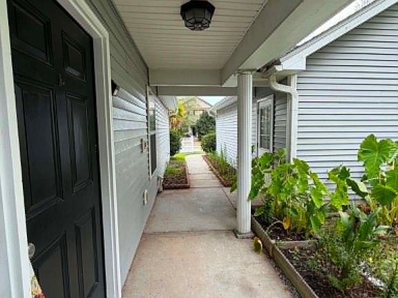 Enjoy added privacy with a front covered entry, tucked away along a charming landscaped walkway.