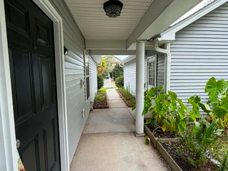 Enjoy added privacy with a front covered entry, tucked away along a charming landscaped walkway.