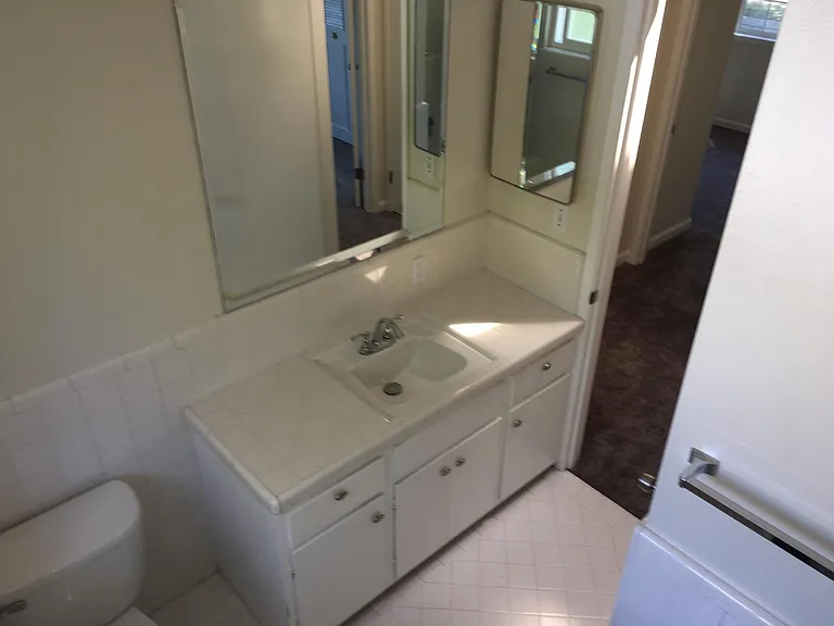 Upstairs bathroom hand sink and storage