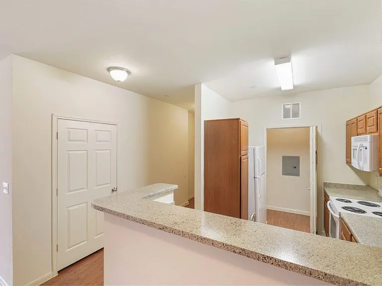 Kitchen with a breakfast bar at Stonehaven Apartments in Houston, TX