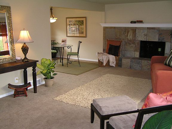 living room w/ custom slate fireplace