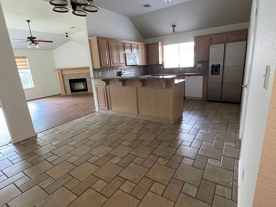 Kitchen flows into large open living room.