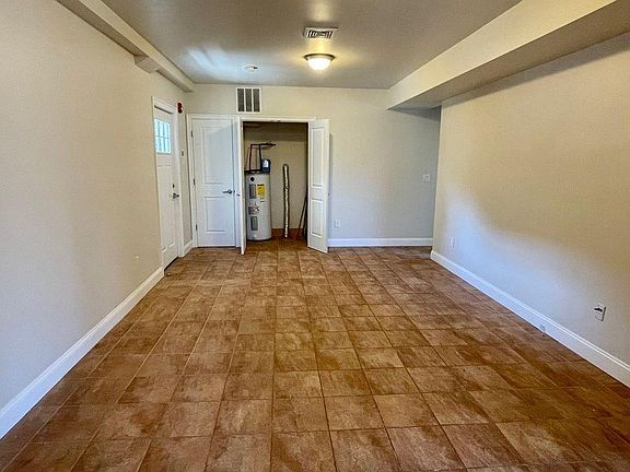 Open Concept Living area. Stone Tile Floors. Hook ups available for Stackable Washer/Dryer