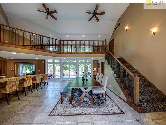 View from entry, views of back yard, dining room, kitchen to the left and stairs to apartment and upper bedrooms.