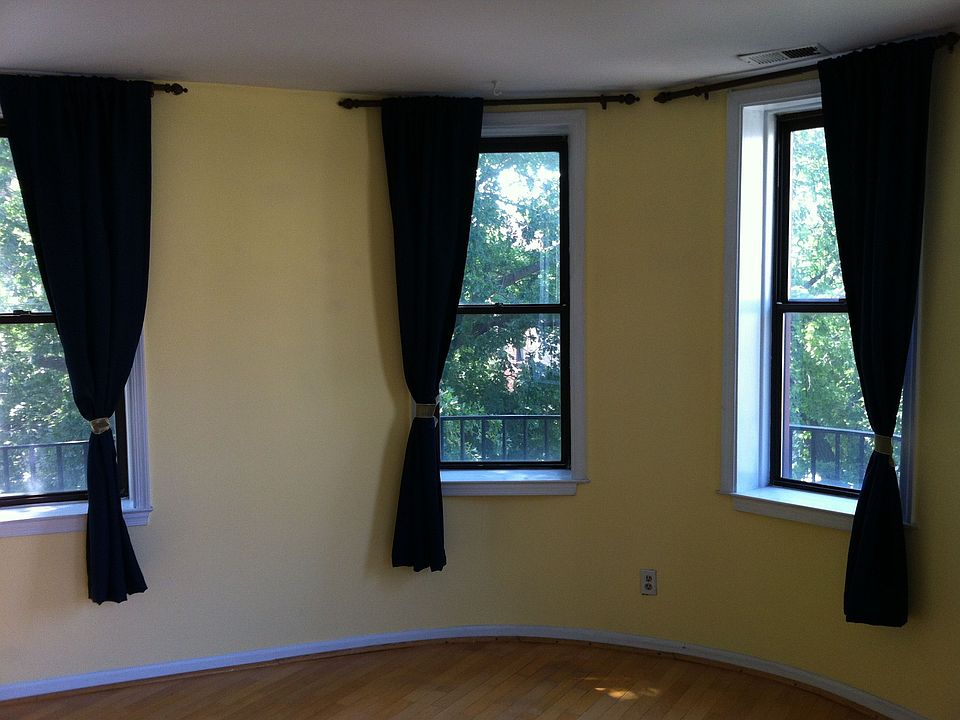 rounded master bed windows