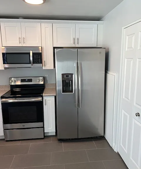 Kitchen, Kitchen Lighting, Granite Sink, Cabinets, Appliances, Tile and Grout Flooring, Newly Painted Ceiling, Walls, Baseboard and Molding.