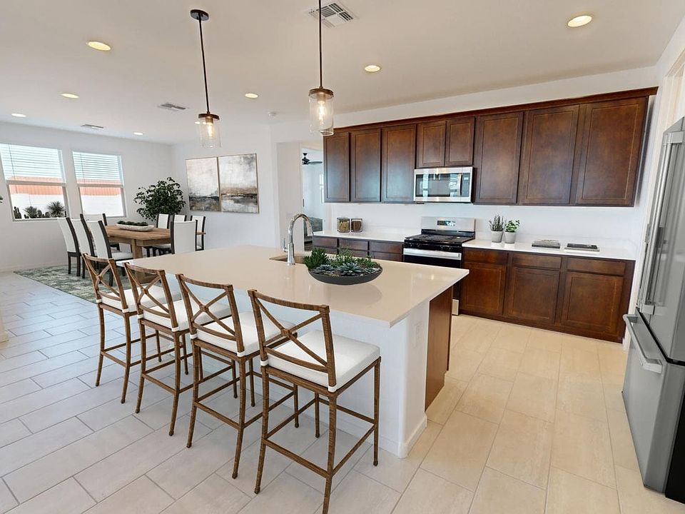 An image of the kitchen with virtually rendered furnishings in the Agave plan at Mariposa.