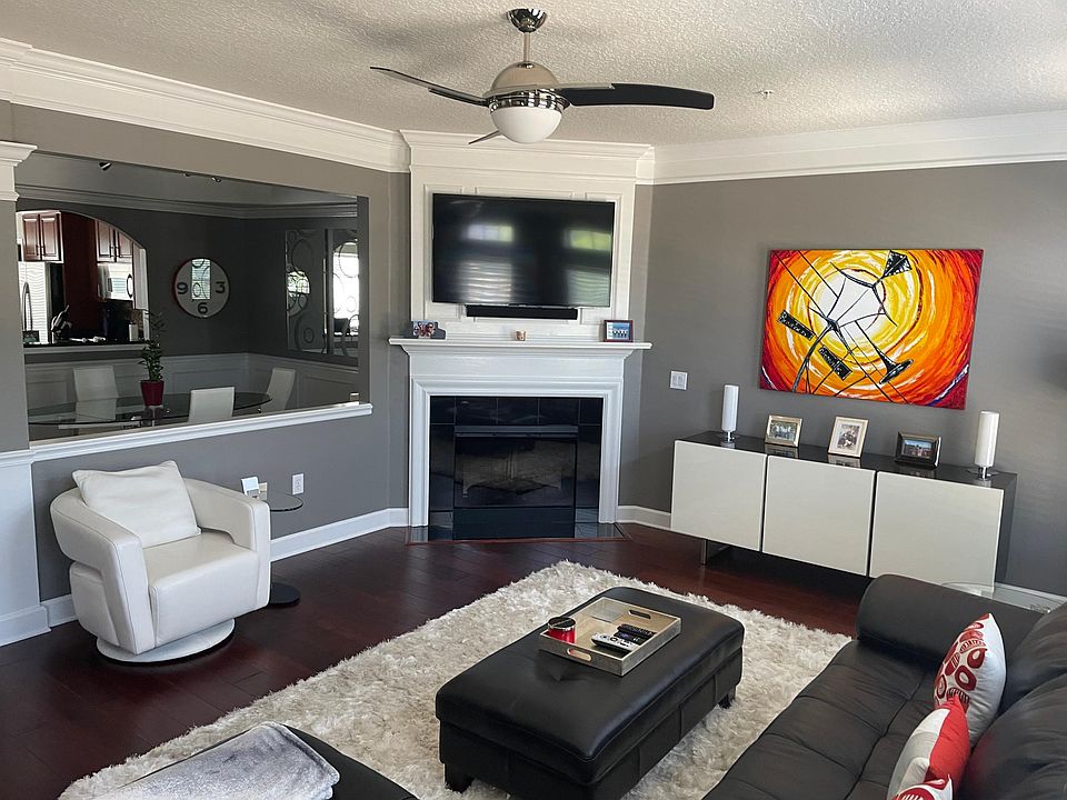 Additional living room open to dining, kitchen and den