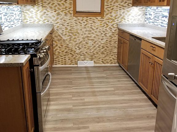 Kitchen w/ recessed lighting and stainless steel appliances