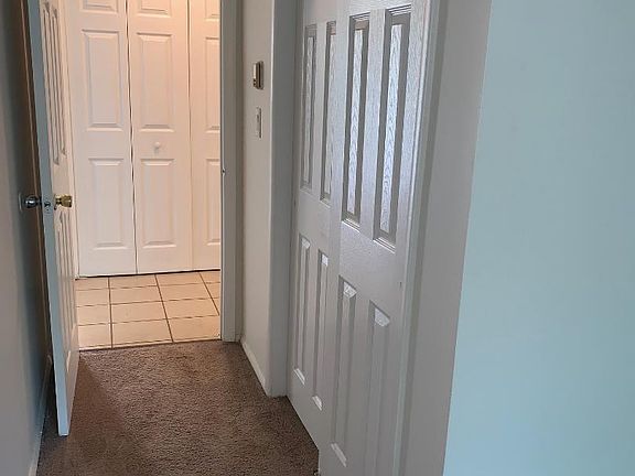 Entryway to spacious bedroom with 2 double closets