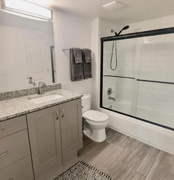 Main floor bathroom -shower with tub! Entrance from main floor hall and main floor bedroom. So fresh and so clean clean!