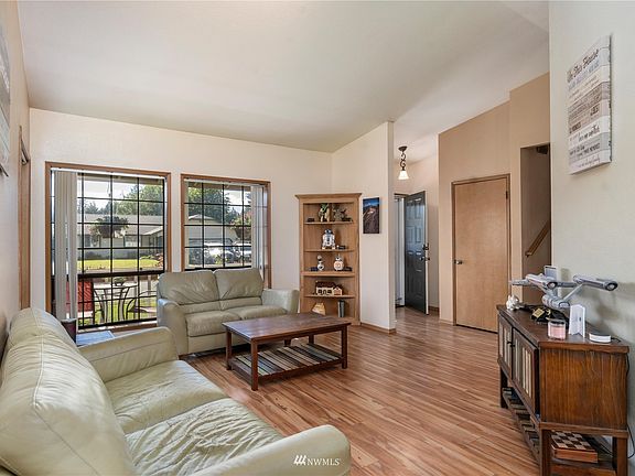View of the living room and entry from the dining room.