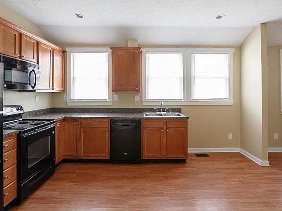 Kitchen with refrigerator, stove, microwave and dishwasher