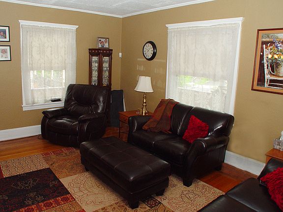 Living room with plenty of natural light and hardwood floors throughout.