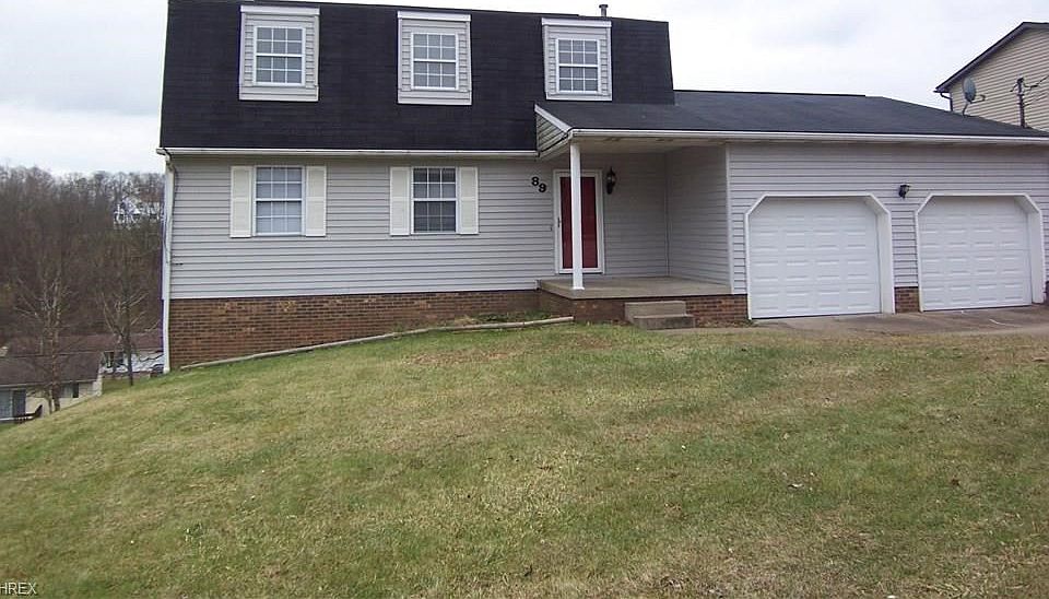 Over 2000 sq. ft of finished living area.  Notice the new garage doors and openers.  Built in 1988. 3 bedroom 2.5 bath.  Yard is 85x126x86x119.