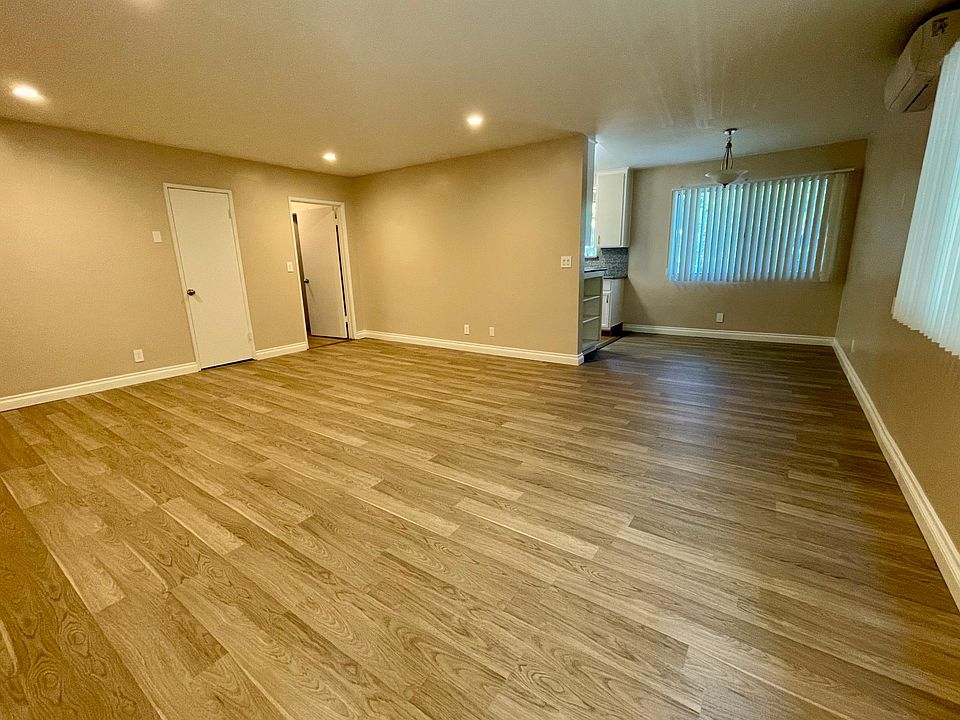 Wide angle of entry with living room and dining area