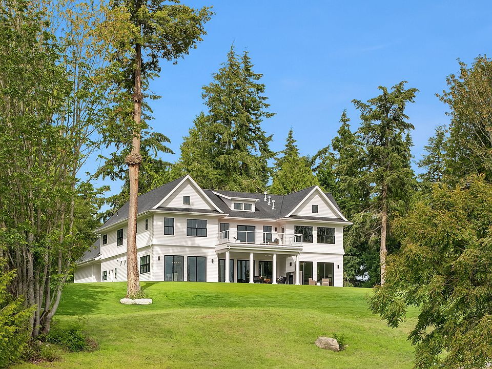 
                    Custom home nestled on an impressive lot with expansive Sound & Mountain views.
                