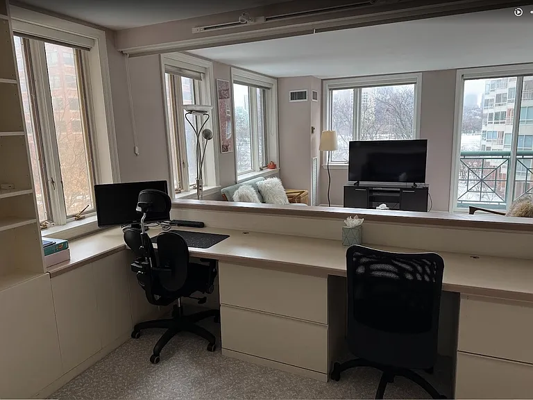 Second bedroom expertly configured as a dedicated home office with a riverview_ideal for remote or hybrid work.