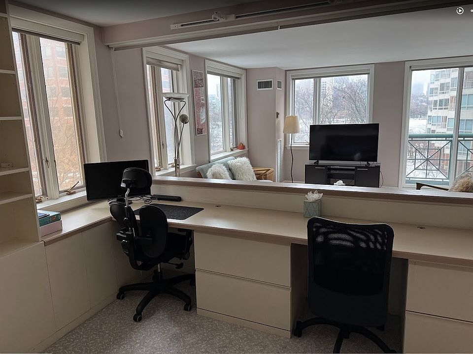 Second bedroom expertly configured as a dedicated home office with a riverview_ideal for remote or hybrid work.