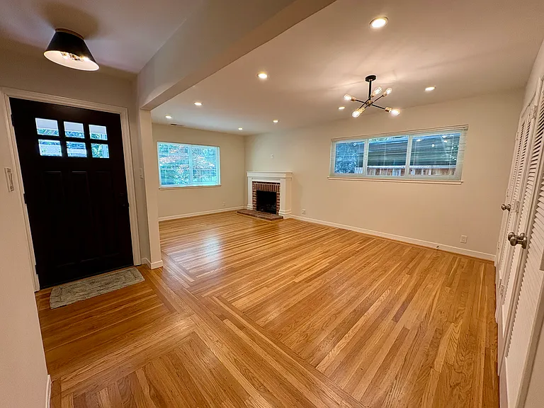 Living room / dining room with recessed lighting and sputnik chandelier