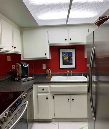 Kitchen (includes: Refrigerator, stove/range, and dishwasher, also with microwave, toaster, and Keurig coffee machine off camera)