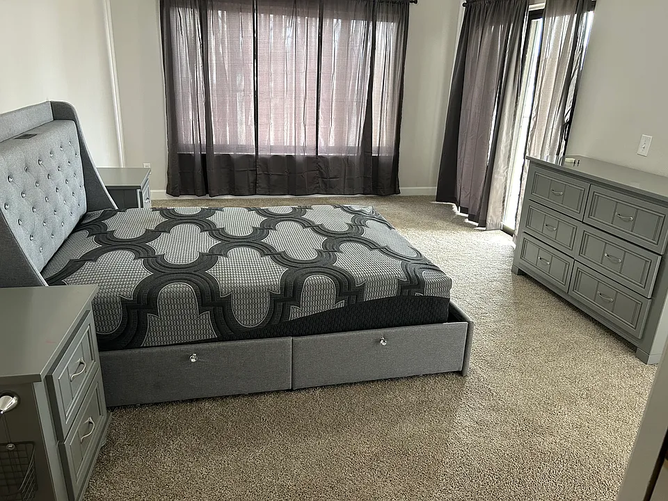 Actual photo of main bedroom. Comes furnished as displayed. Room measures 16' 9" x 11' 9".