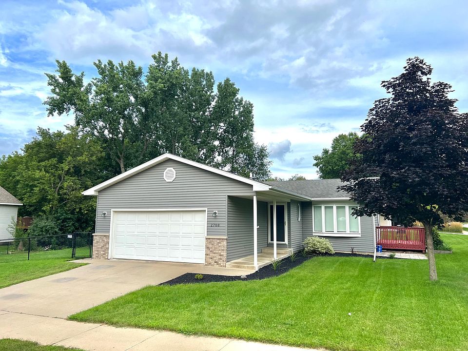 Outside of home. Fenced yard on side.
