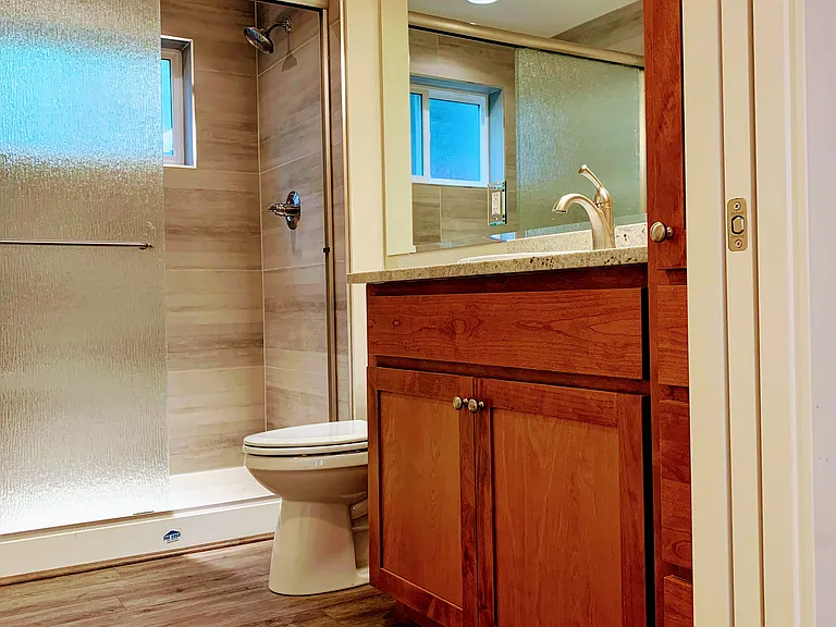 Spacious tiled shower.