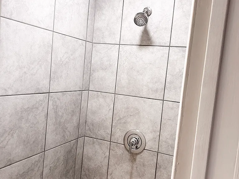 Walk in shower. New tile and fixtures.