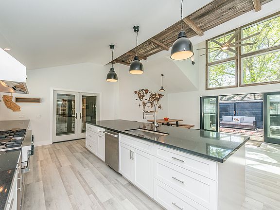 Open kitchen with oversized island and professional-grade range