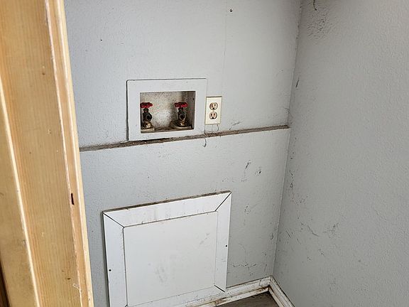 Washer hook ups in laundry nook.