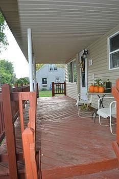 Plenty of space on the covered front porch for furniture.  A nice spot to enjoy the morning coffee before staring off on a busy day.