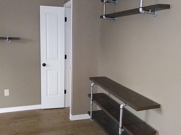 Custom built entertainment center- wood/ galvanized pipe..