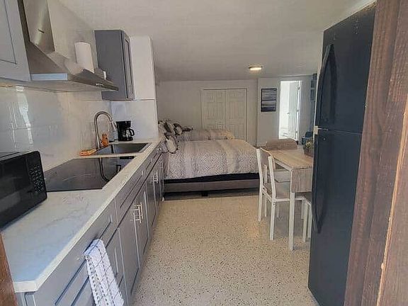 Fully equipped modern kitchen with dishwasher and essential comforts.