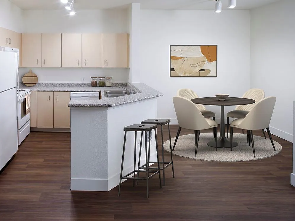 Kitchen and dining room with hard surface flooring (select homes) - eaves RockMeadow
