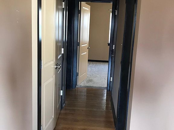 Hallway with w/d, leading from living room to bedroom.