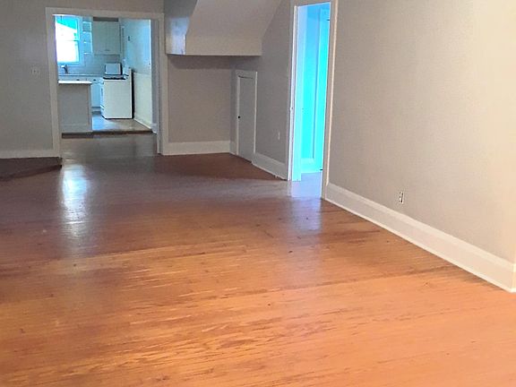 In the main living area, you'll enjoy high ceilings, lots of