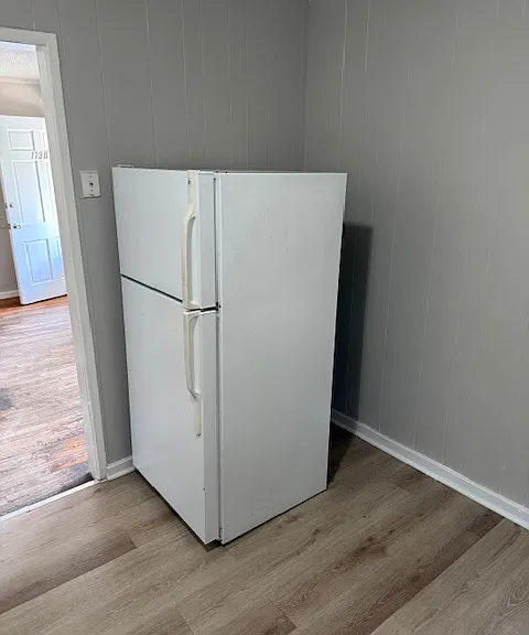 Kitchen with new LVP flooring.