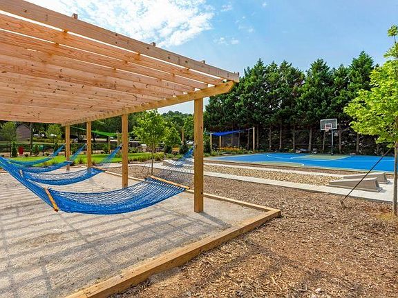 outdoor family area with basketball court!