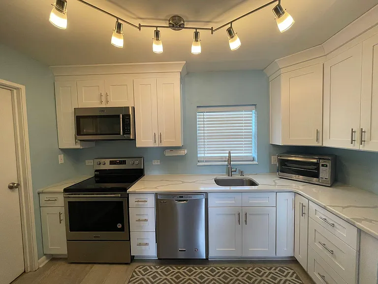Kitchen with walk in pantry. Lighting with dimmer.