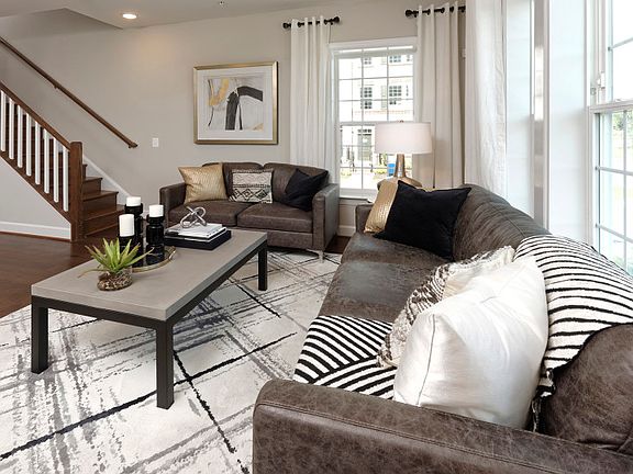 Model Representation - Great Room with Hardwood Floors and is Open to the Kitchen and Dining Space
