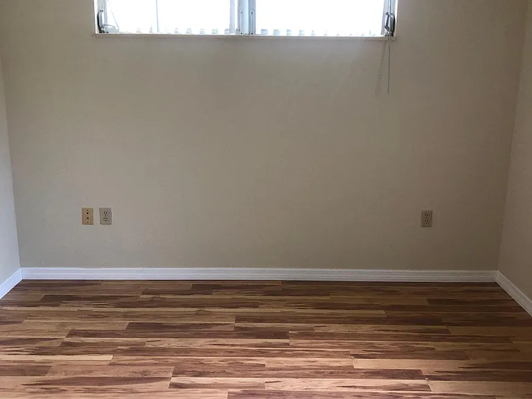 GUEST OR SECOND BEDROOM WITH SMOOTH FLOORING AND NATURAL LIGHT