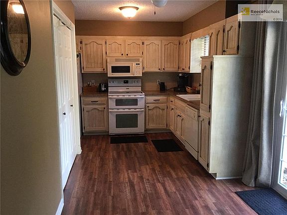 Kitchen with laundry and new flooring.