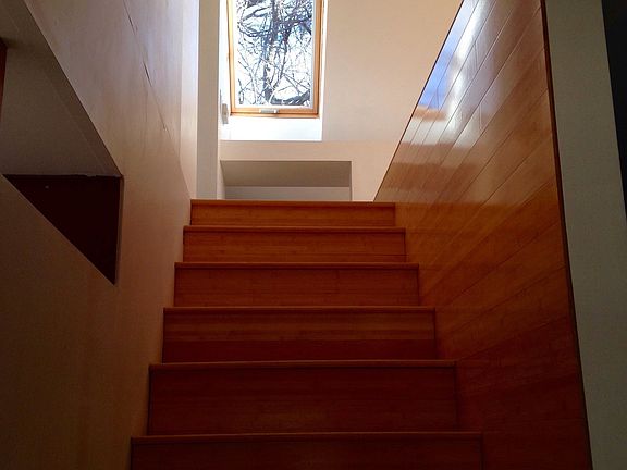 2 story house separating living area from bedroom