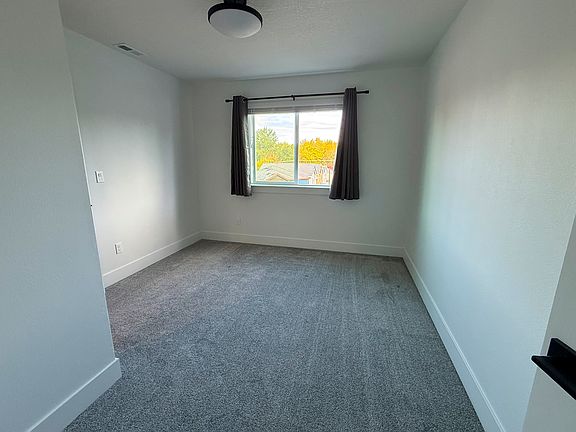 The bedroom available on the top floor of a newly built home near Nike, Costco, and 2 train stations.
