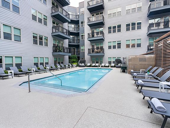 Relax by the sparkling courtyard pool_perfect for a refreshing dip or unwinding in a private lounge chair.