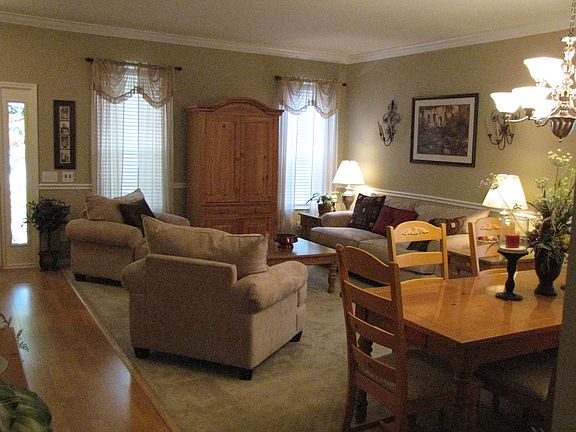 Formal Living and Dining Room with Crown Moulding and Chair Rail